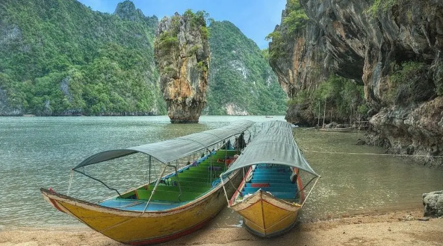 People go on boat tours in PhangNga Bay to see the vertical limestone rocks