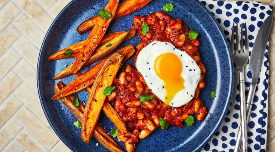 Indian-Style Beans, Fried Egg And Sweet Potato Wedges